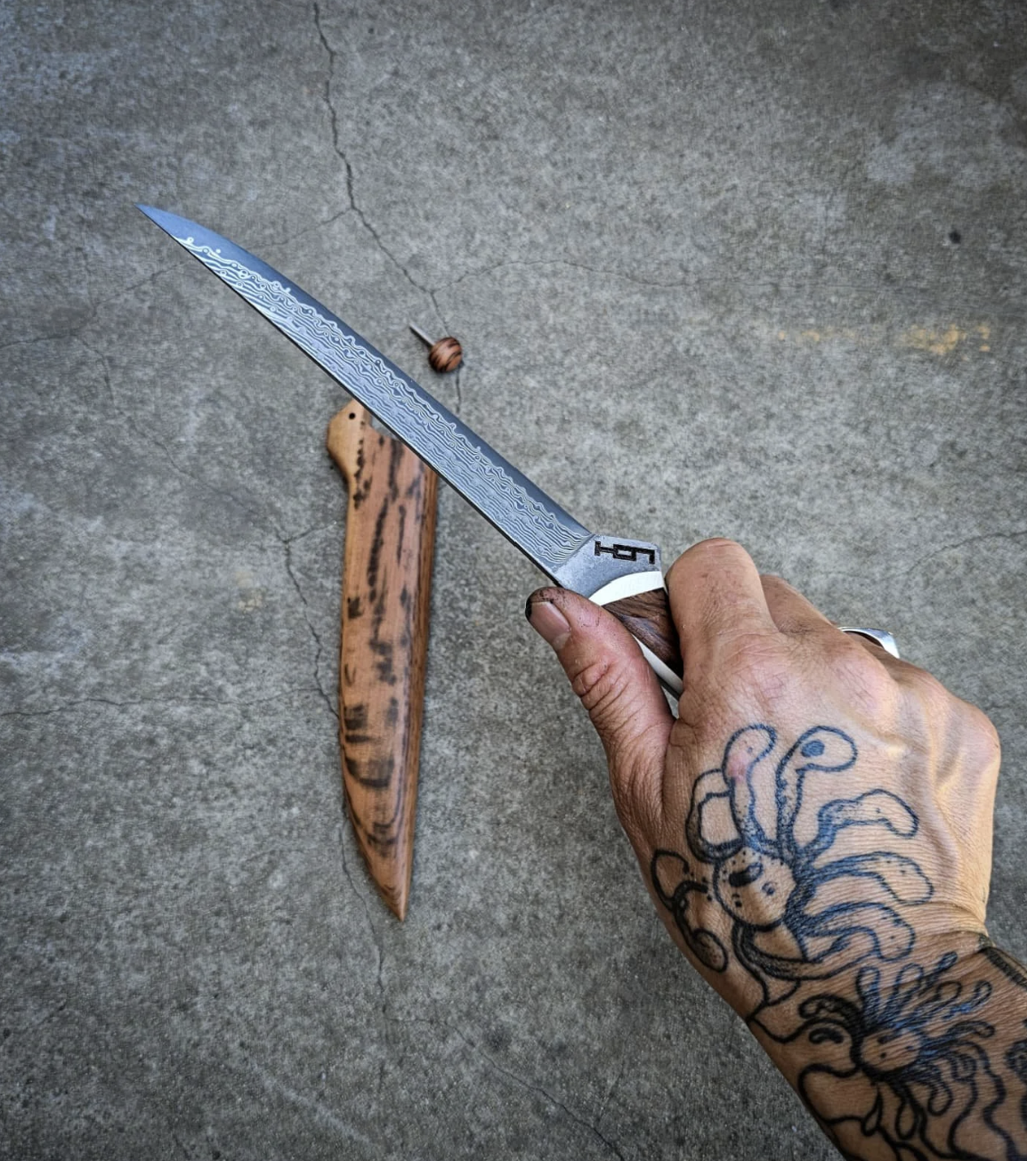 Damascus blade in hand